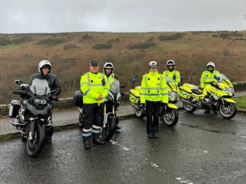 Officers from the national motorcycle unit stand beside their bikes at the Campsie Hills with Chief Superintendent Hilary Sloan to launch the Motorcycle Safety Campaign 2024
