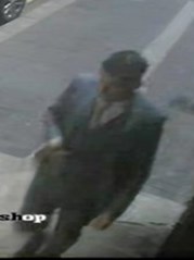 white, approximately 25-35 years old, with dark-coloured hair which was shaved at the back and sides. He was wearing a grey three-piece checked suit and black shoes