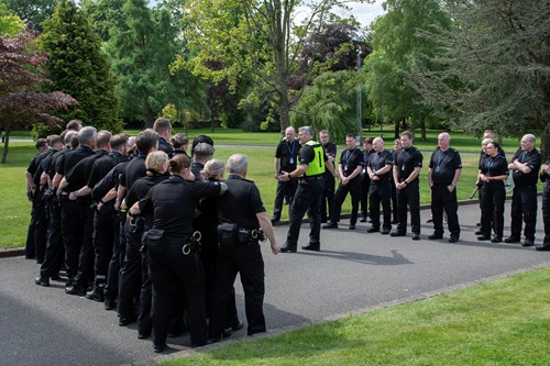 A large group of special constables receive training on the grounds of Tulliallan