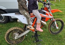 Orange and white motorcross bike