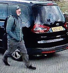 The image shows CCTV of Roderick waring walking trousers, a navy jacket, glasses and has a black backpack