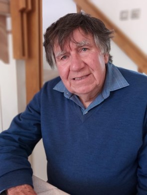 87-year-old man wearing blue jumper and shirt