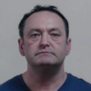 Image of man sentenced, Robert Stirling - white man in 50s with short dark hair wearing a blue t-shirt