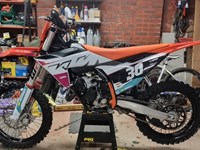Orange and white motorcross bike
