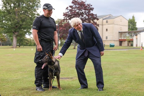 Prime Minister Boris Johnson meets a dog handler at Police Scotland HQ, Tulliallan