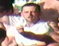 Image of second male - white t-shirt with short dark hair and facial hair
