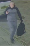 CCTV image of male in grey and black jumper