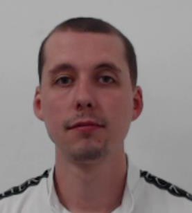 Image shows a man white short dark hair