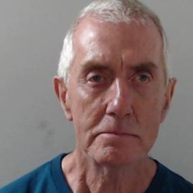 Image of jailed man Anthony McElhone - white man in 70s with short white/grey hair wearing teal t-shirt