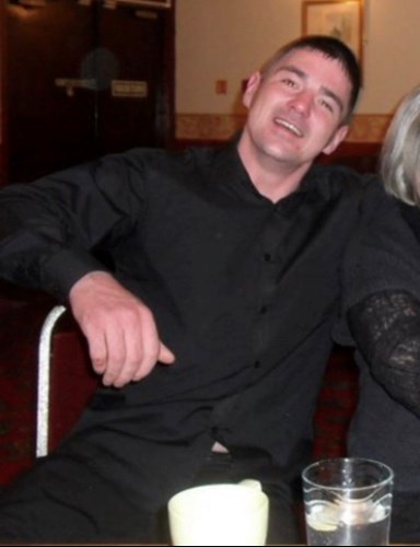 Shows Robert Bromell, who died after a crash involving an ambulance in Oban. White, European male with dark, short hair and wearing a black shirt