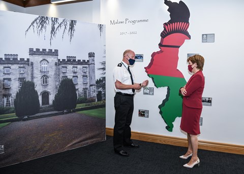First Minister Nicola Sturgeon discusses the work of Police Scotland's International Academy with Inspector Craig Rankine