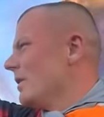 First man close-up of head as described in text
