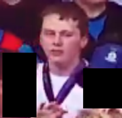 Image of fifth male - young man with white shirt and blue/purple band round neck with short dark hair