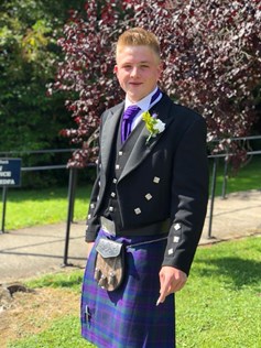 26-year-old man wearing kilt outfit