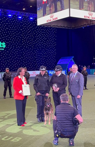 Constable Carly Fulton and Police Dog Ben receive award in Crufts main arena