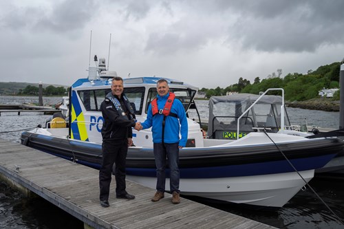 Assistant Chief Constable Williams shaking hands with Jason Purves from Ultimate Boats